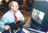 Dr. Dawson reviews medical accuracy on simulator.